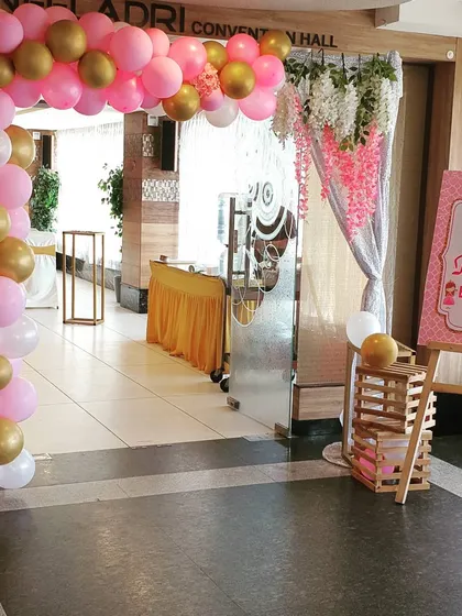 The entrance to Punarvi's party, designed to welcome guests into the fairytale. A pink, white, and gold balloon arch frames the doorway, complemented by a personalized welcome sign on an easel, setting the tone from the moment guests arrive.