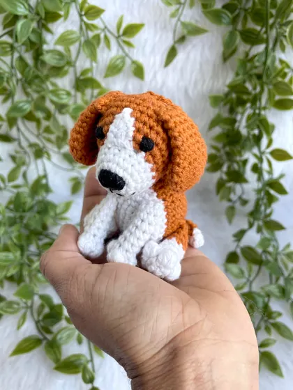 A tiny crochet dog keychain, perfect for any dog lover. This little beagle is small enough to fit in your palm but is full of character.