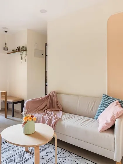 This shot highlights the cozy corner with framed illustrations and a simple dining setup, proving that thoughtful design can make any space beautiful.