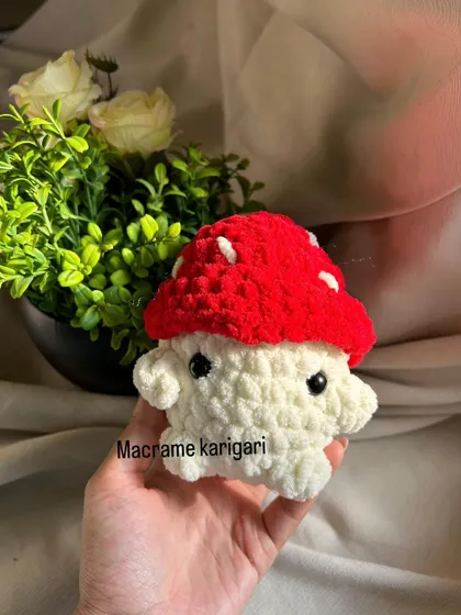 Another shot of our mini mushroom plushie. It's small enough to sit on a desk or shelf, adding a touch of handmade charm.