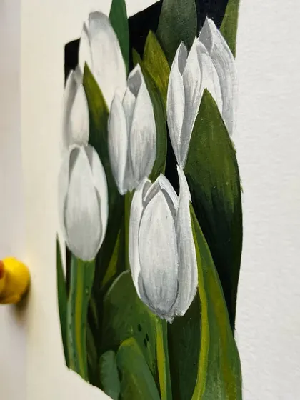 A side view of the white tulips painting.