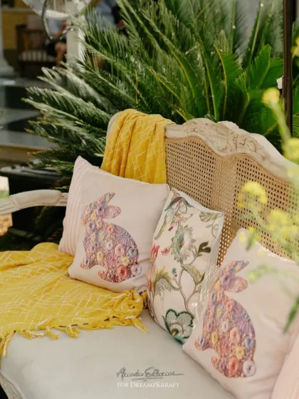 Custom-printed cushions featuring a bunny motif, a personal nod to the couple's love story which began at a cafe in London.