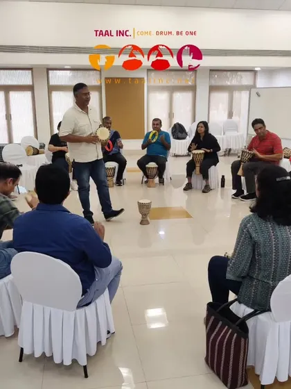 I am leading a leadership training session where we use group drumming as a metaphor for team dynamics. It’s amazing to see how strategies for collaboration and leadership emerge naturally when people are engaged in a fun activity.