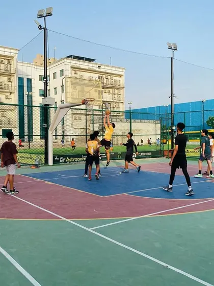 Intense action under the basket as players vie for scoring position.