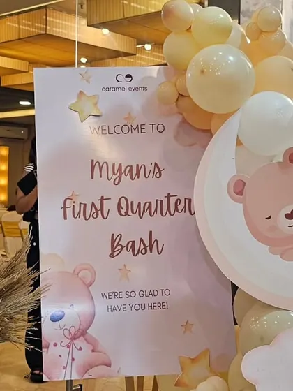 The personalized welcome sign for the celestial-themed party, decorated with matching graphics and a small balloon arrangement.