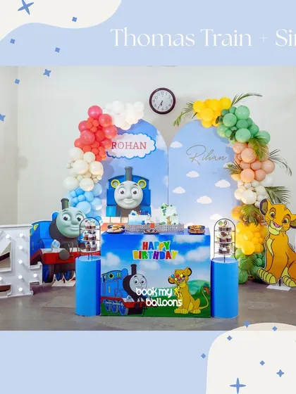 When you can't pick just one favorite, we combine them. This unique party for Rohan's fourth birthday featured a fun mashup of Thomas the Train and Simba from The Lion King, with custom backdrops and character cutouts for double the fun.