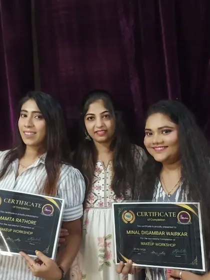 More happy graduates from our makeup workshop, holding their certificates.