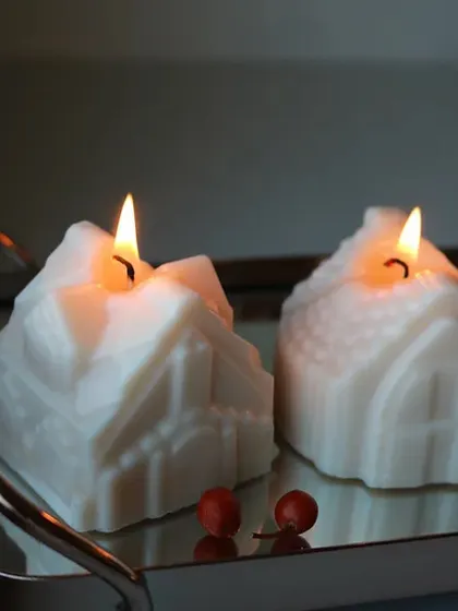 Our Christmas collection includes these charming house-shaped candles, perfect for creating a cozy holiday atmosphere.