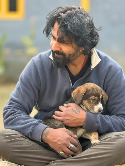 A quiet moment of connection between me and a puppy. This is the heart of what we do, building trust and providing comfort.