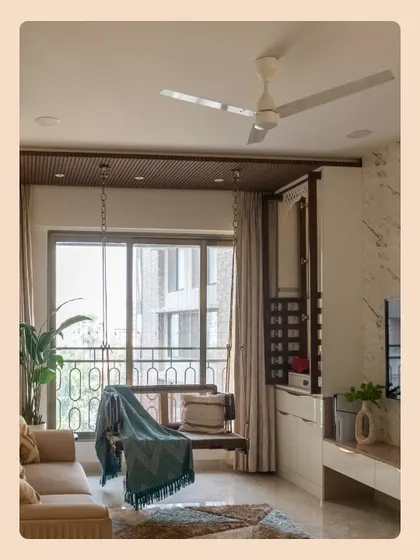 A wider view of the living room, showing how the wooden swing is perfectly integrated with the seating area, creating a cozy and balanced layout.