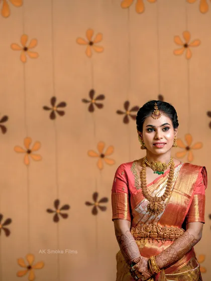 A classic portrait against a patterned wall, showcasing the bride's elegance and poise.