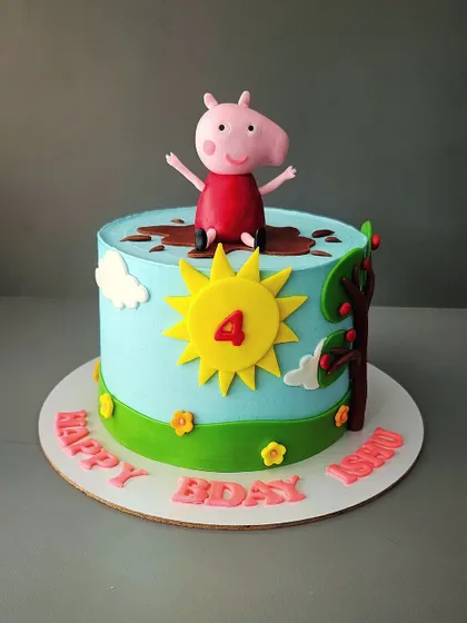 Peppa Pig enjoying a muddy puddle on Ashni's 4th birthday cake. This almond sponge cake captures one of Peppa's favorite activities in a fun and edible scene.