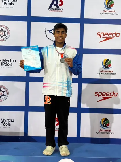 Samarth Gowda on the podium with his bronze medal.
