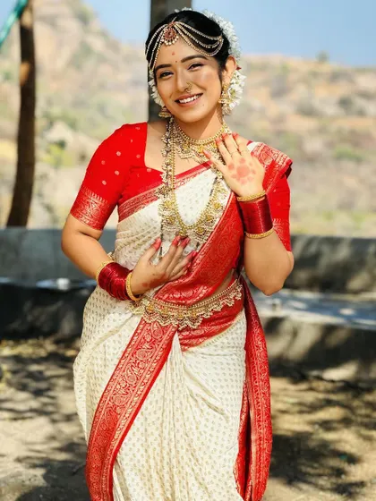 This photo captures the joy and elegance of the traditional Kerala bridal look, available for rent for your special day.