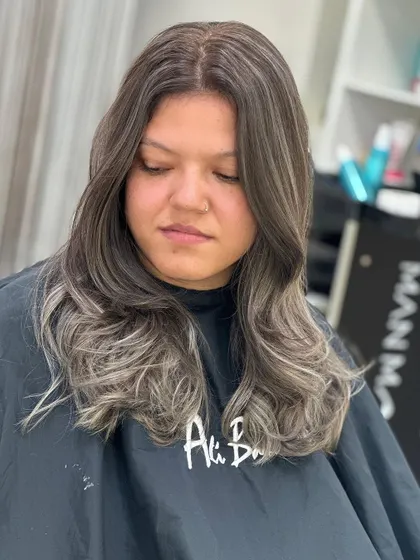 A beautiful after shot of an ash balayage, with cool tones blending seamlessly from the roots.