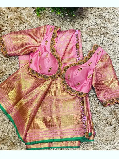 A top-down view of the pink scalloped blouse and Kanjeevaram saree set.