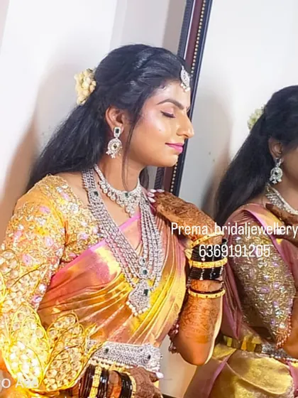 A side view showing the details of the layered necklace and the matching earrings.