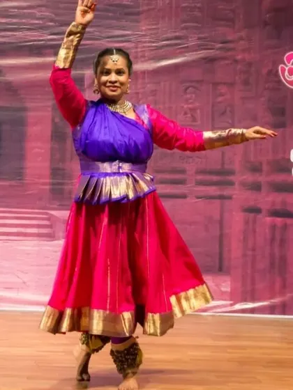 A Kathak performer in a vibrant costume, showcasing the grace and poise taught in our classes. We emphasize correct posture and fluid movements from the very beginning of the training.