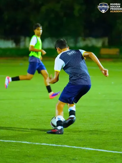 A player executes a sharp turn with the ball, a crucial skill for evading defenders and creating space.