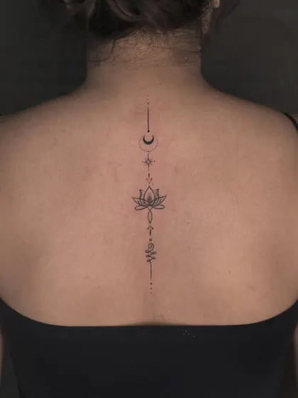 Sometimes, the most powerful statements are the most delicate. This fine-line spine tattoo is a perfect example of our minimalist work, designed to be both elegant and deeply personal, accentuating the body's natural lines.
