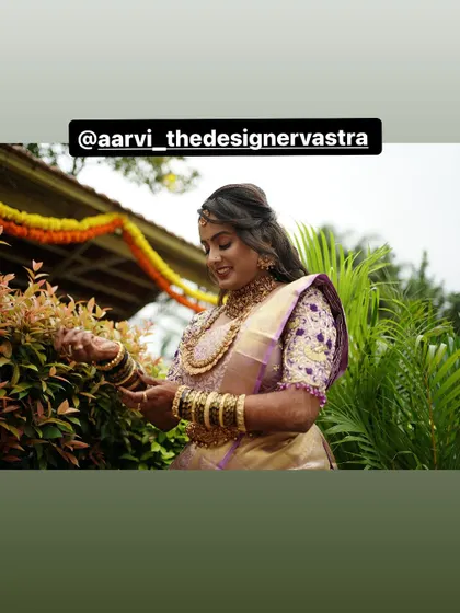 A candid moment of the bride in her reception saree. The blouse embroidery was designed to match the details on the groom's tuxedo.