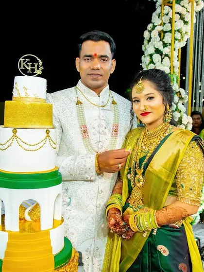 It brings us so much joy to see our clients with their cakes on their special day. This happy couple is celebrating their engagement with our five-tier royal cake, a grand centerpiece for their outdoor celebration.
