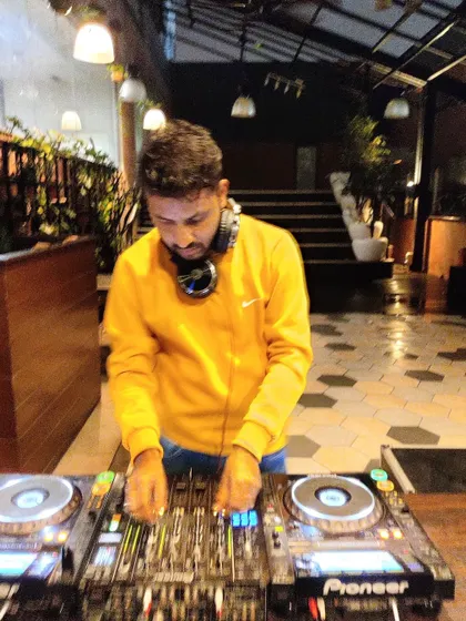 Sometimes the mood calls for lighter music to set a relaxed and magical tone. Here I am at an event, carefully selecting tracks to match the sophisticated ambiance.