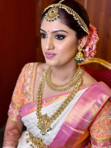 Another angle of Madhurima's bridal makeup, showing the subtle contour and highlight that defines her features.