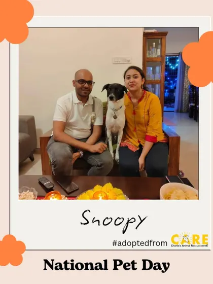 Snoopy, another one of our adoptees, posing proudly with his family. Every photo like this is a success story for us.