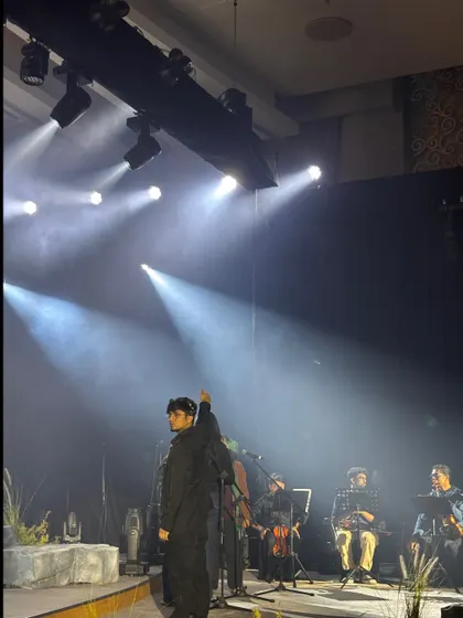 An artist on stage during the TATA Sierra launch event. Our artist management team ensures performers have everything they need for a great show.