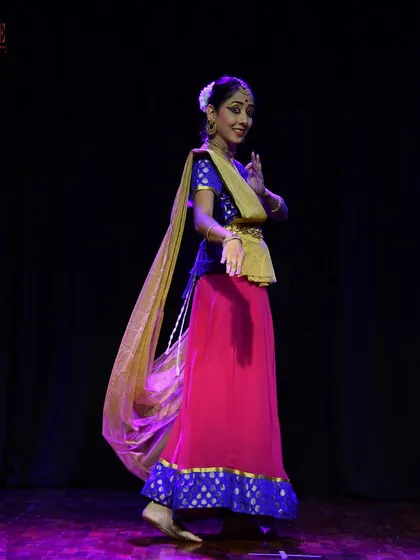 A student from our adult Kathak batch, capturing the grace and storytelling essence of the dance form during her performance.