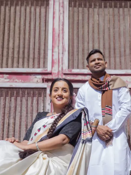 The couple poses against a rustic, old-world backdrop, perfectly capturing the essence of their vintage pre-wedding theme.