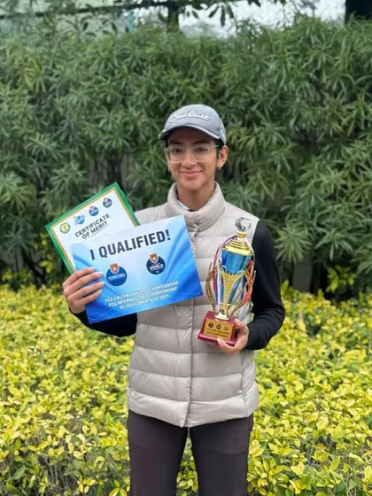 Jiyya Sharma with her Runner-up trophy and qualification certificates from the FCG & IMG Qualifier.