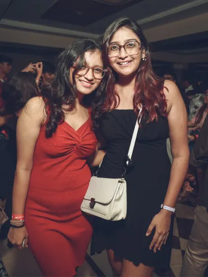 Friends posing for a photo while enjoying the party. A great DJ night is also a great social event, and I provide the perfect backdrop for it.