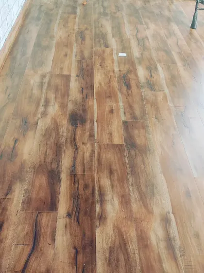A classic wooden laminate flooring installation. This type of flooring adds warmth and value to any room and is available in many different shades and textures.