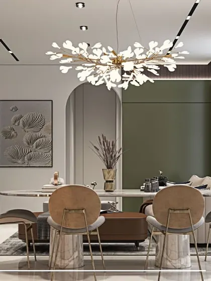The dining room in our 'Contemporary Fusion' project is a statement in itself, with a leaf-shaped chandelier and a bold, dark accent wall.