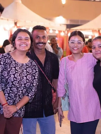 A group of friends and family enjoying the outdoor event.