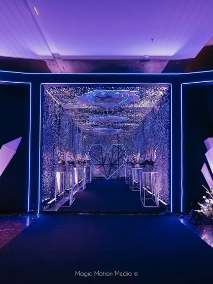 The entrance to a celestial-themed Sangeet, where guests are greeted by glowing crystal formations before entering the 'Tunnel of Love'.
