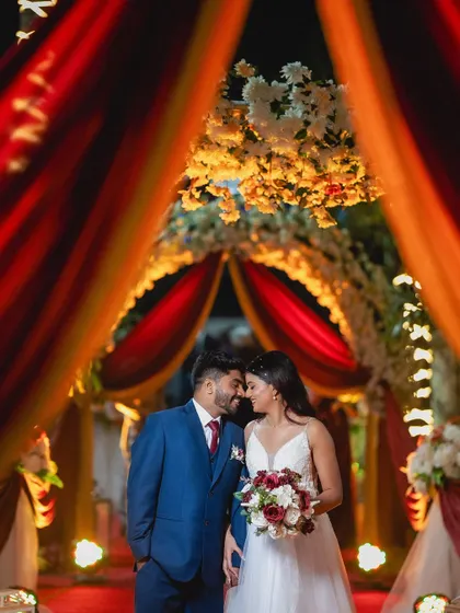 The final result is a groom who looks confident and radiant next to his partner. This romantic shot captures the couple looking their absolute best during their wedding celebration.
