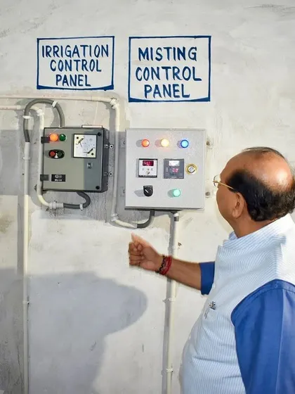 The Honourable LG of Delhi, Shri V.K. Saxena, personally inspecting the system's control panel. This central unit manages the entire misting operation, showcasing the automated and reliable nature of my pollution control solution. His involvement underscores the project's success and importance.