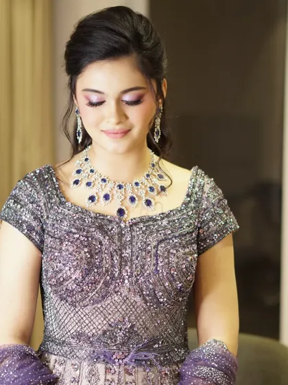 Timeless glamour in every blink. For Safaagaa, we used a soft lilac shimmer on the eyes to match her regal jewels, creating an ethereal glow that was even more breathtaking in person.