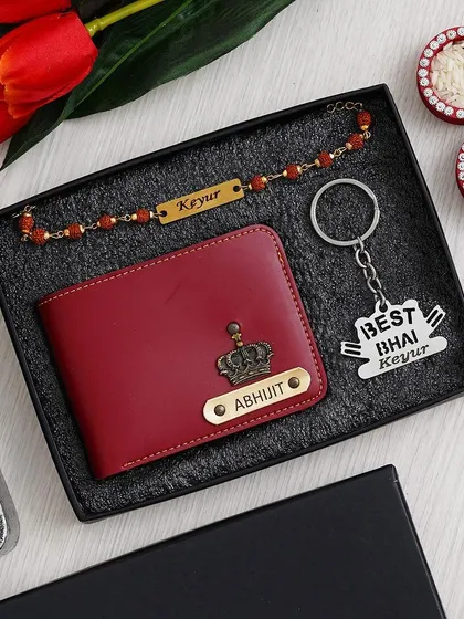 A stylish Rakhi gift set for your brother, including a personalized red wallet, a "Best Bhai" stainless steel keychain, and a name-engraved Rudraksh rakhi.
