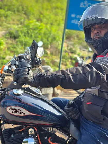 Dayananda sir on his Harley-Davidson, also fully geared up. Safety is a value shared by every member of our riding group.