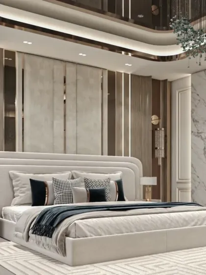 Elegance defined in this bedroom with a mix of textures. It features a cream upholstered headboard, vertical wall panels with metallic accents, and a curved false ceiling design with recessed lighting.