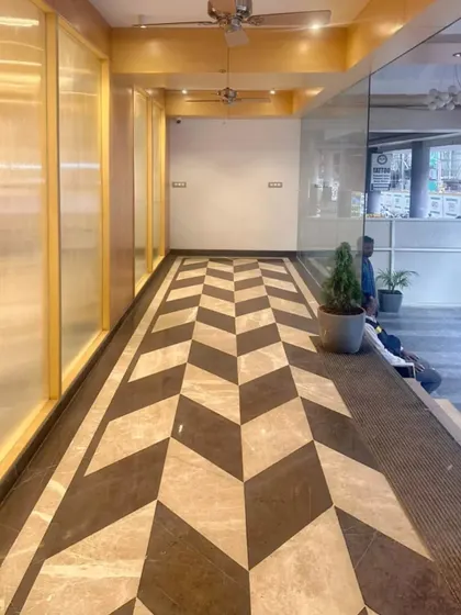 The entrance ramp at our Bhopal project features a bold, chevron-patterned floor. We believe even functional spaces like ramps should be designed with intention and style.