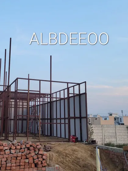 The initial stages of a double-story porta cabin building in Meerut. You can see the decking sheet laid for the first floor and the MS frame for the walls going up.