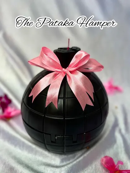 For the "Pataka" sister, this bomb-shaped hamper is a fun and unique choice. The black bomb shell opens up to reveal a curated selection of gifts inside, making for an explosive surprise.