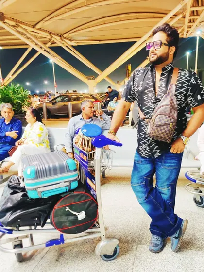 Waiting at the airport for our flight to Kolkata. My instruments are my constant travel companions.