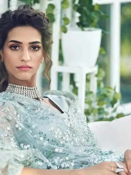 This is a complete reception or engagement party look. The makeup is glamorous yet sophisticated, with defined eyes and a balanced lip, paired with a soft, curly hairstyle. I ensure the final look works beautifully with your outfit, jewelry, and the event's ambiance.
