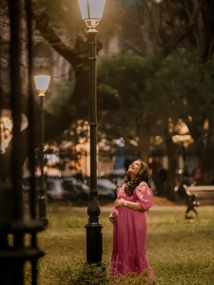Even in an outdoor park setting, I use available light, like this lamppost, to create a cinematic feel. Anisha's joyful, upward glance feels spontaneous and full of hope.